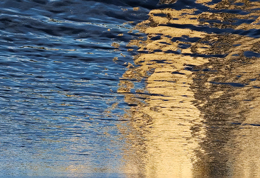 Abstract photograph by Mac Beach capturing golden reflections breaking across deep-blue ripples on the Intracoastal Waterway in Delray Beach, Florida, 2025.