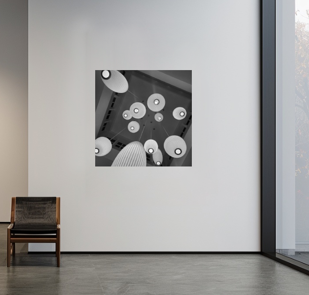 A 40 × 40-inch black-and-white acrylic print displayed in a contemporary interior setting.